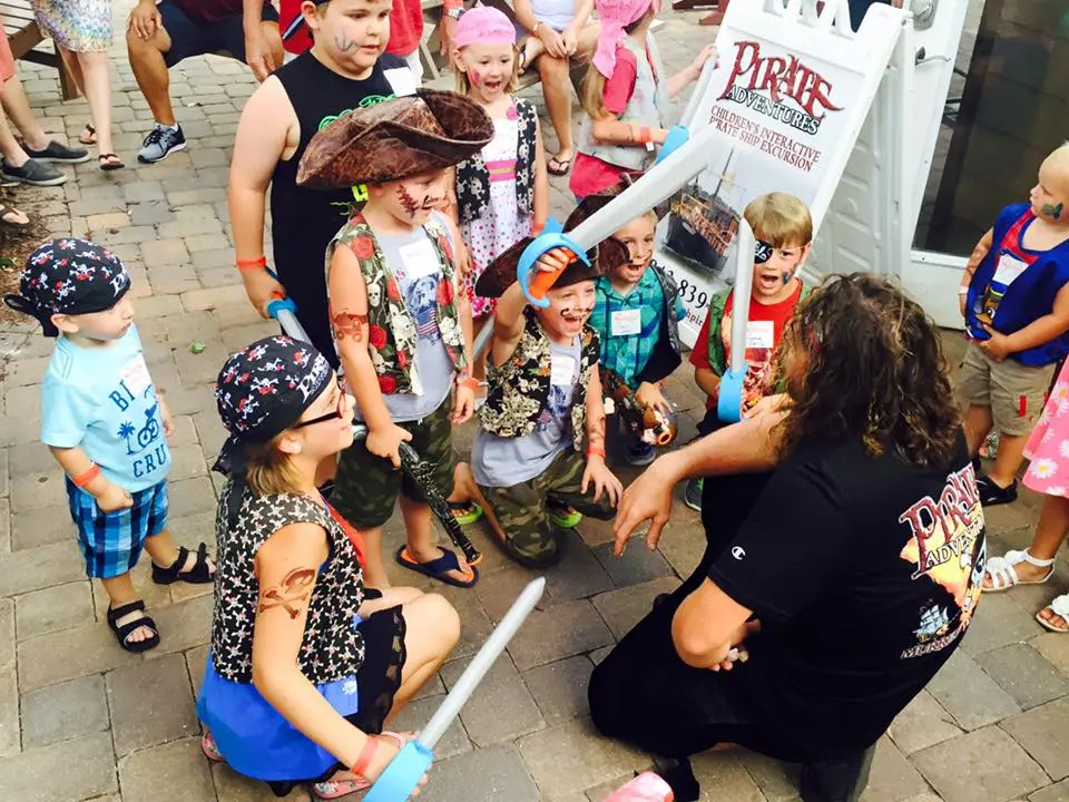 A group of kids excited to be dressed up as pirate