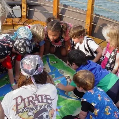 A group of kids looking at a map